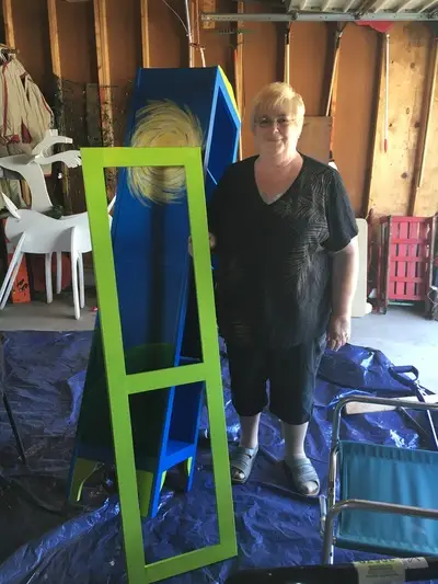 artist Connie putting together Little Free Library