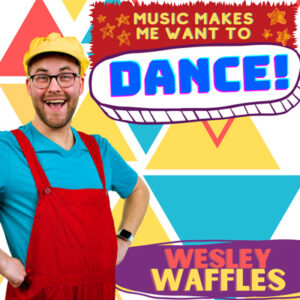 smiling Wesley Waffles wearing a blue tshirt, red overalls, yellow hat and glasses