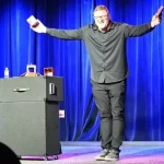 Jim Lenz on stage doing magic