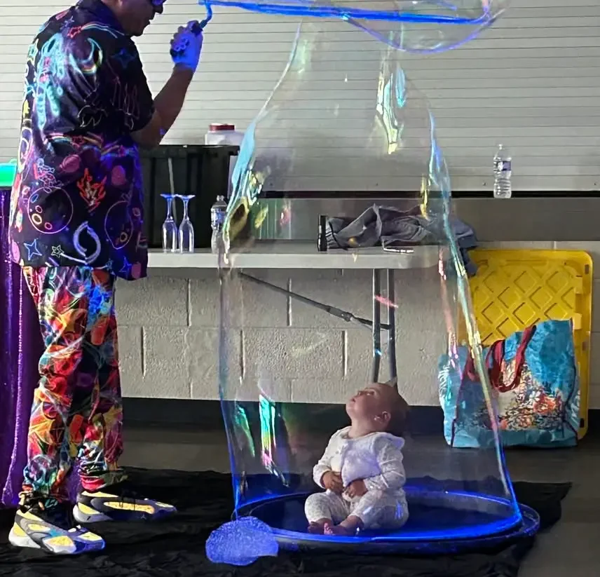 Rondini encases a baby inside of bubble